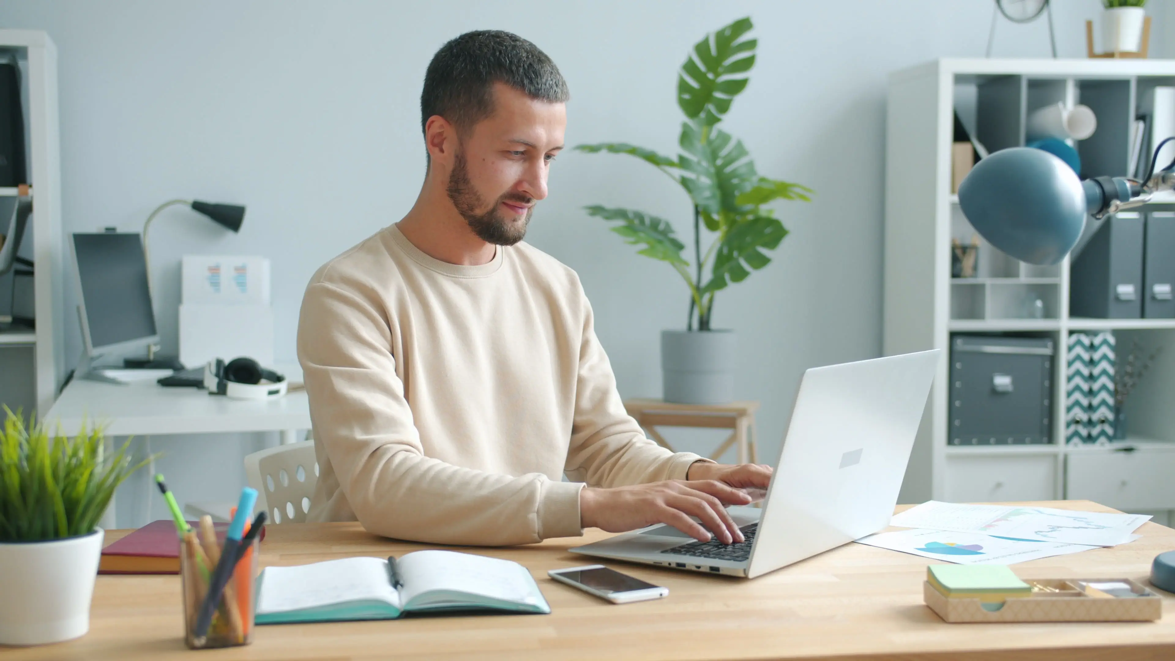 Frustrated remote professional reviewing a misleading employment contract on a laptop screen