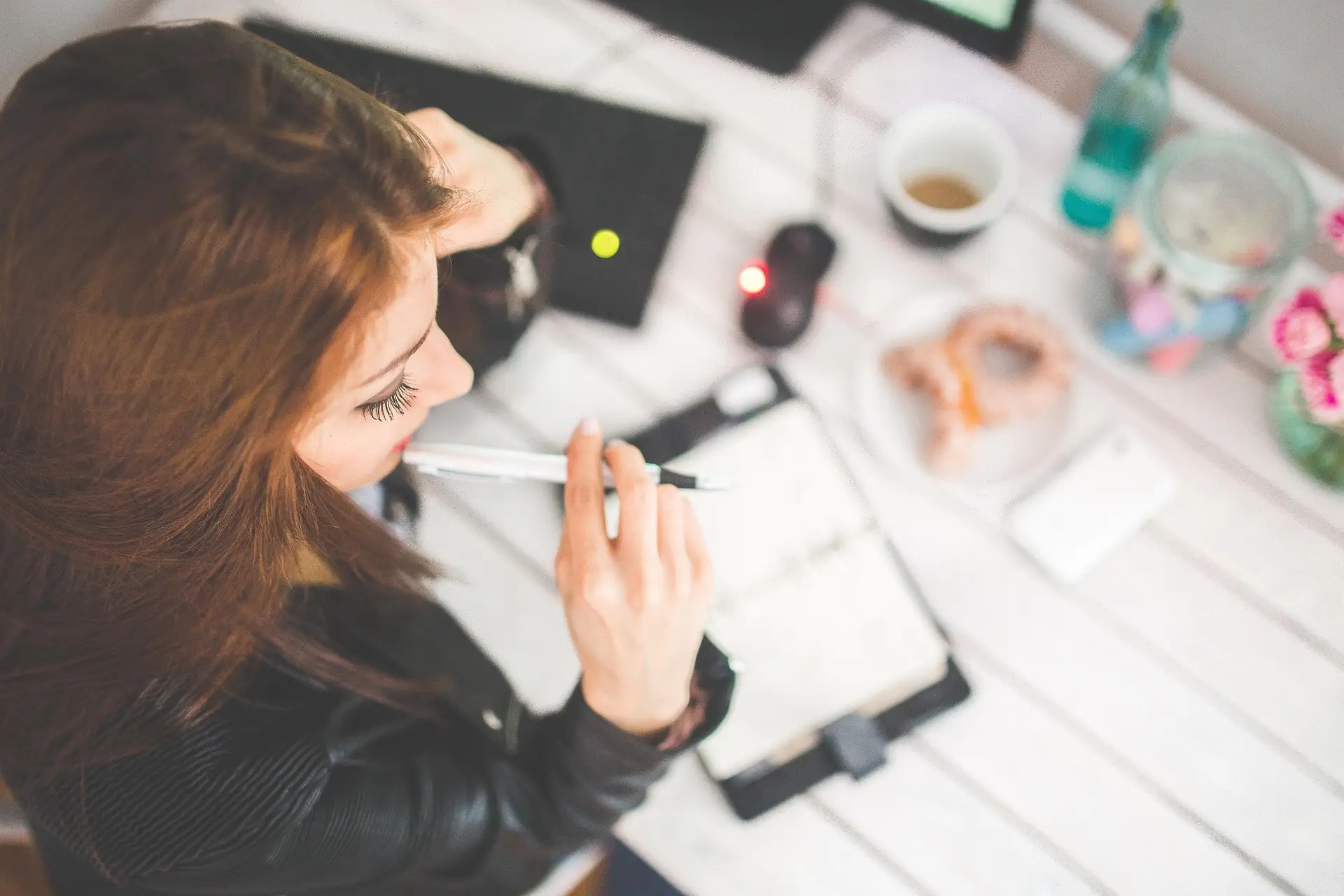 Thoughtful professional analyzing corporate benefits and career growth opportunities